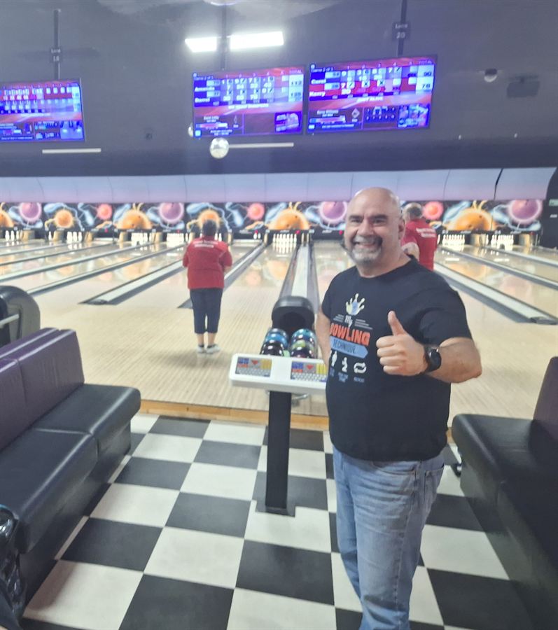 Giving a thumbs-up at the bowling alley